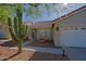 Front view of the house showcasing desert landscaping at 4047 E Rowel Rd, Phoenix, AZ 85050