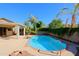 Relaxing pool area with brick coping and a spacious patio at 4047 E Rowel Rd, Phoenix, AZ 85050