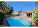 Large backyard pool with patio and access to house at 4047 E Rowel Rd, Phoenix, AZ 85050