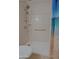 Walk-in shower with grab bars and tiled walls at 4047 E Rowel Rd, Phoenix, AZ 85050