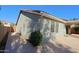 Landscaped side yard with gated access and concrete pathway at 4047 E Rowel Rd, Phoenix, AZ 85050