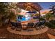 Enjoy the Arizona evenings in your private backyard oasis, complete with a pool and relaxing patio furniture at 44314 W Yucca Ln, Maricopa, AZ 85138