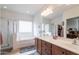 Elegant bathroom with a double vanity, soaking tub, and shower at 5010 S Veneto --, Mesa, AZ 85212