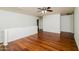 Bright bedroom with wood floors and ceiling fan at 533 W Prickly Pear Dr, Casa Grande, AZ 85122