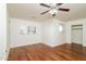 Bedroom with wood floors, ceiling fan, and window seat at 533 W Prickly Pear Dr, Casa Grande, AZ 85122