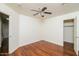 Spacious bedroom with wood floors and ceiling fan at 533 W Prickly Pear Dr, Casa Grande, AZ 85122