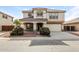 Two-story house with a landscaped front yard and attached two-car garage at 533 W Prickly Pear Dr, Casa Grande, AZ 85122