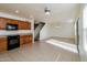 Kitchen with wood cabinets, tile floor, and black appliances at 533 W Prickly Pear Dr, Casa Grande, AZ 85122