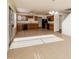 Open kitchen with wood cabinets, tile floor, and breakfast bar at 533 W Prickly Pear Dr, Casa Grande, AZ 85122