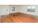 Bright living room featuring hardwood floors and large windows at 533 W Prickly Pear Dr, Casa Grande, AZ 85122