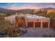 Three-car garage, landscaped yard, and beautiful Southwestern architecture at 5640 E Miramonte Dr, Cave Creek, AZ 85331