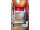 Small bathroom with shower/tub combo and red walls at 5640 E Miramonte Dr, Cave Creek, AZ 85331