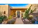 Ornate entry gate with desert landscaping and pathway at 5640 E Miramonte Dr, Cave Creek, AZ 85331