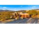 Two-story home with stucco exterior, showcasing mountain views and desert landscaping at 5640 E Miramonte Dr, Cave Creek, AZ 85331