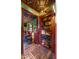 Hallway with built-in shelves and unique tin ceiling at 5640 E Miramonte Dr, Cave Creek, AZ 85331