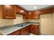 Small kitchen with wood cabinets and granite counters at 5640 E Miramonte Dr, Cave Creek, AZ 85331