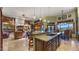 Island kitchen with granite counters, dark wood cabinets, and breakfast bar at 5640 E Miramonte Dr, Cave Creek, AZ 85331