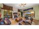 Open living area with a stone fireplace and large windows with mountain views at 5640 E Miramonte Dr, Cave Creek, AZ 85331