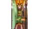 Unique staircase with green walls, vintage art, and a chandelier at 5640 E Miramonte Dr, Cave Creek, AZ 85331