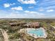 Community pool, clubhouse, and surrounding desert landscape at 7979 E Evening Glow Dr, Scottsdale, AZ 85266