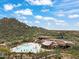 Community pool and clubhouse with desert mountain views at 7979 E Evening Glow Dr, Scottsdale, AZ 85266