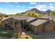 Single story home with mountain views and a desert landscape at 7979 E Evening Glow Dr, Scottsdale, AZ 85266