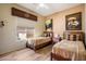 Twin bedroom with two beds and southwestern decor at 7979 E Evening Glow Dr, Scottsdale, AZ 85266