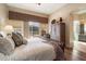 Spacious bedroom with king-size bed and access to backyard at 7979 E Evening Glow Dr, Scottsdale, AZ 85266
