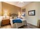 Cozy bedroom with queen-size bed and wood flooring at 7979 E Evening Glow Dr, Scottsdale, AZ 85266