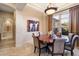Bright dining room with round table and chairs, showcasing artwork and natural light at 7979 E Evening Glow Dr, Scottsdale, AZ 85266