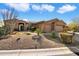 Single-story home with desert landscaping and a two-car garage at 7979 E Evening Glow Dr, Scottsdale, AZ 85266