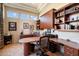 Spacious home office with built-in bookcases and a large desk at 7979 E Evening Glow Dr, Scottsdale, AZ 85266