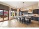 Spacious kitchen with large island, breakfast bar, and access to patio at 7979 E Evening Glow Dr, Scottsdale, AZ 85266