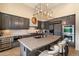 Modern kitchen featuring a large island, double oven, and wine cooler at 7979 E Evening Glow Dr, Scottsdale, AZ 85266