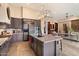 Gourmet kitchen with island, stainless steel appliances, and ample cabinetry at 7979 E Evening Glow Dr, Scottsdale, AZ 85266