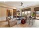 Elegant living room with stone fireplace, built-ins and ample natural light at 7979 E Evening Glow Dr, Scottsdale, AZ 85266