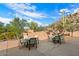 Outdoor patio with seating and built-in BBQ grills at 7979 E Evening Glow Dr, Scottsdale, AZ 85266
