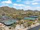 Aerial view of community tennis courts and surrounding landscape at 7979 E Evening Glow Dr, Scottsdale, AZ 85266