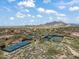 Aerial view of community tennis courts and surrounding landscape at 7979 E Evening Glow Dr, Scottsdale, AZ 85266