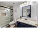 Modern bathroom with walk-in shower, toilet and vanity at 7999 W Mary Jane Ln, Peoria, AZ 85382