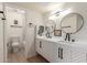 Modern bathroom with double vanity and a chevron pattern at 8055 E Thomas Rd # D110, Scottsdale, AZ 85251