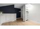 Well-organized loft closet with built-in shelves at 8055 E Thomas Rd # D115, Scottsdale, AZ 85251