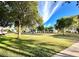 Spacious community green with mature trees and well-maintained lawns at 8211 E Mcdonald Dr, Scottsdale, AZ 85250