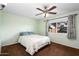 Bright bedroom with ceiling fan and ample closet space at 9843 W Cedar Dr, Sun City, AZ 85351