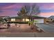 Single-story house with a desert landscape and a two-car garage at 9843 W Cedar Dr, Sun City, AZ 85351