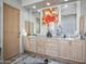 Double vanity bathroom with modern light fixtures at 10040 E Happy Valley Rd # 2001, Scottsdale, AZ 85255