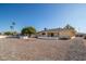 Large backyard with gravel landscaping and fire pit at 10734 W Tropicana Cir, Sun City, AZ 85351