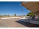 Patio with seating area and golf course view at 10734 W Tropicana Cir, Sun City, AZ 85351