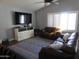 Relaxing living room with leather sofas, a large TV, and a decorative rug at 1106 N Palm St, Gilbert, AZ 85234