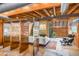 Living room features copper room dividers, stone flooring and a beamed ceiling at 1251 W Rancho Dr, Phoenix, AZ 85013